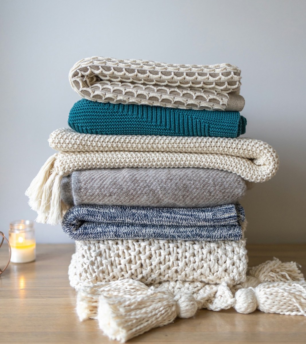 Stack of folded throw blankets